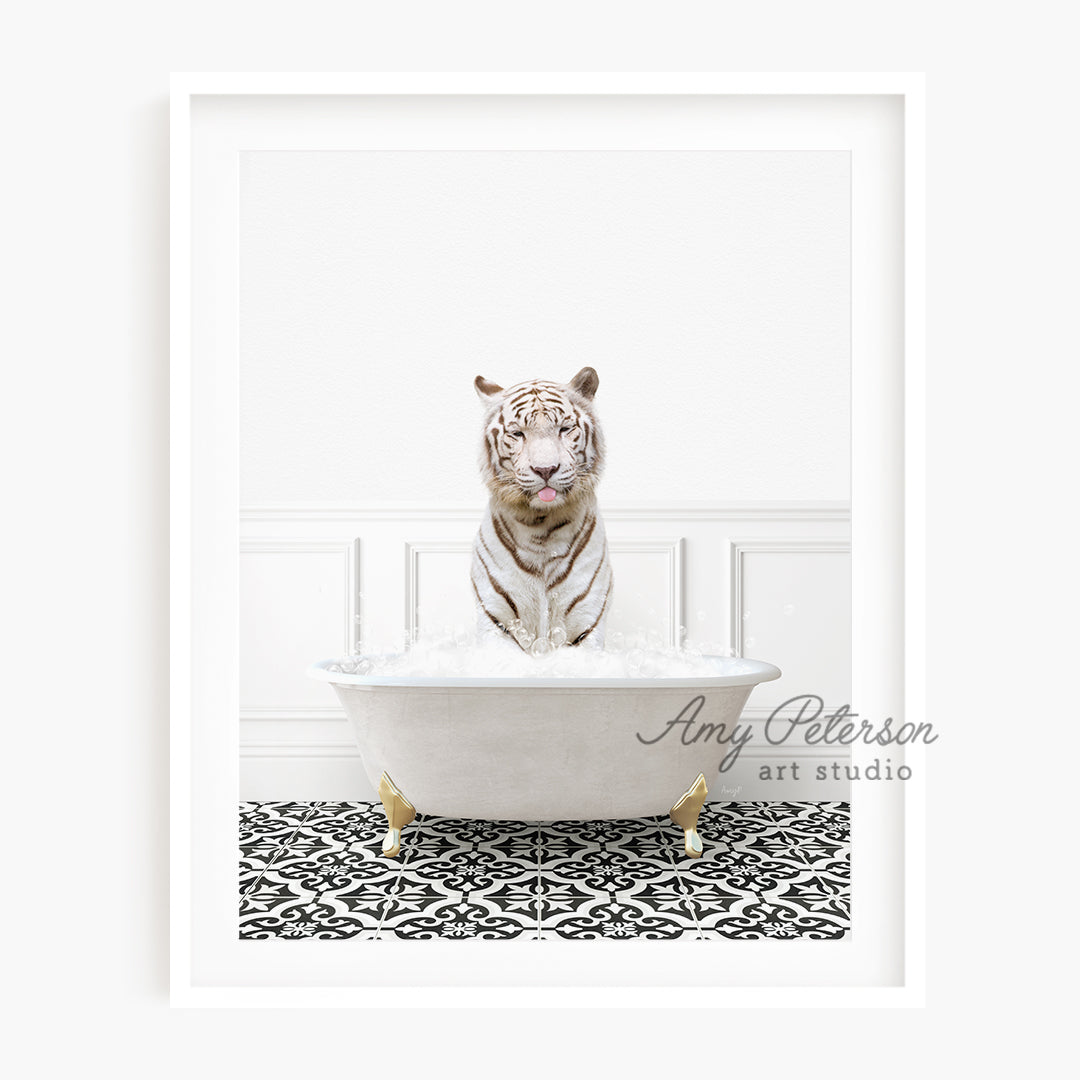 a white tiger is sitting in a bathtub