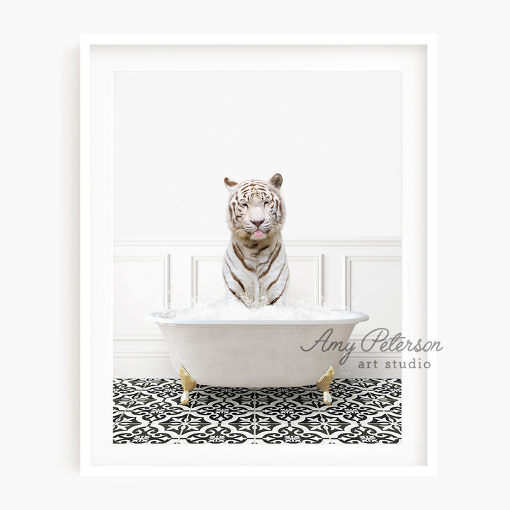 a white tiger is sitting in a bathtub