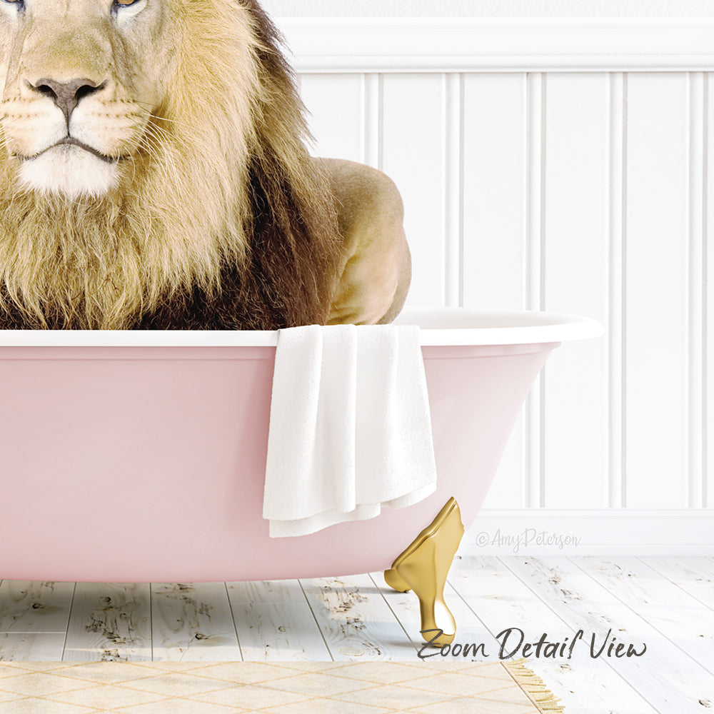 A lion is sitting in a pink bathtub, with a towel and golden shoe placed on the side of the tub.