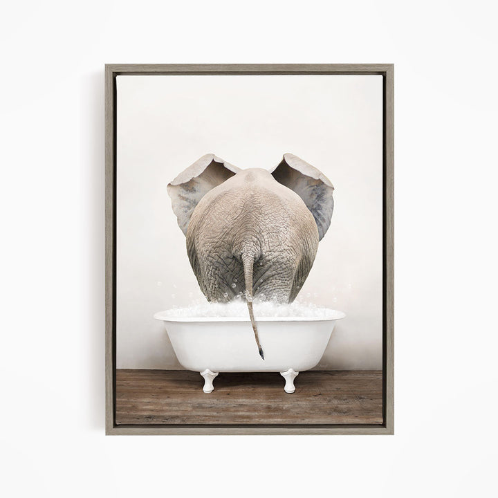 A gray elephant is standing in a white bathtub filled with water, with its back turned to the viewer.
