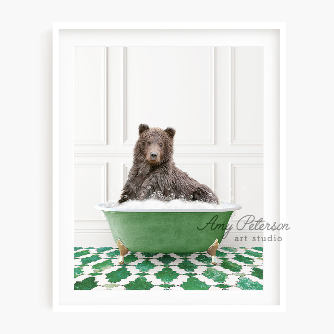 a brown bear sitting in a green bath tub