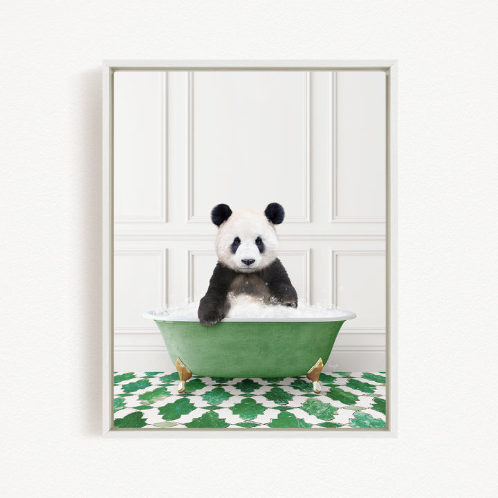 A panda bear sitting in a green bathtub filled with bubbles, surrounded by a green and white patterned rug.