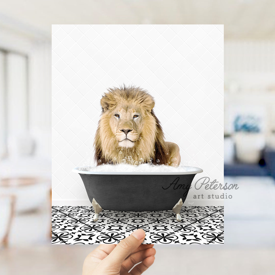 a hand holding a card with a lion in a bathtub