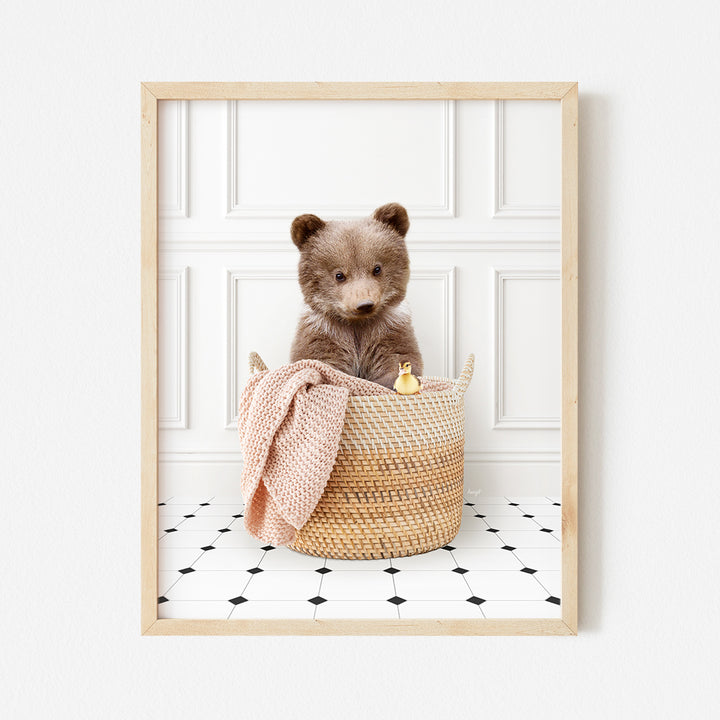 a brown teddy bear sitting in a basket