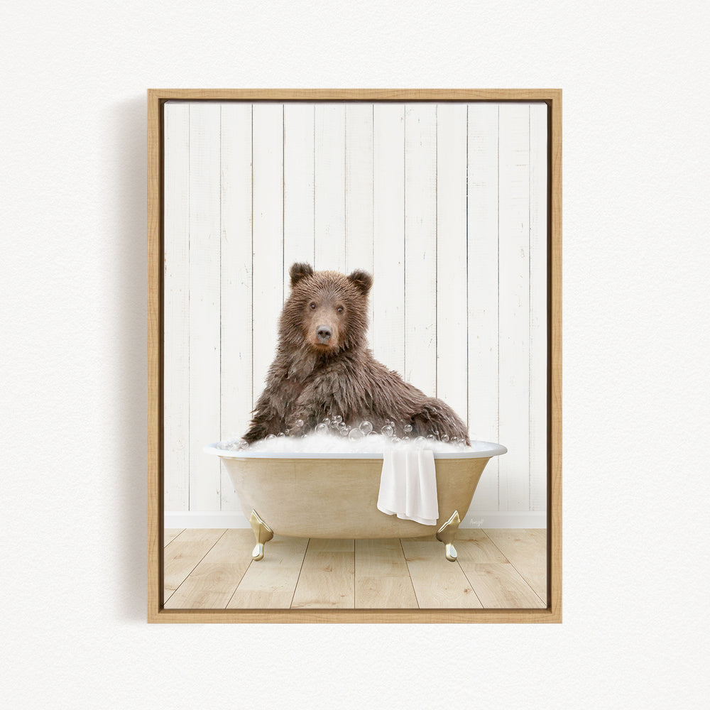 A brown bear sitting in a bathtub filled with water, surrounded by a white wooden wall.