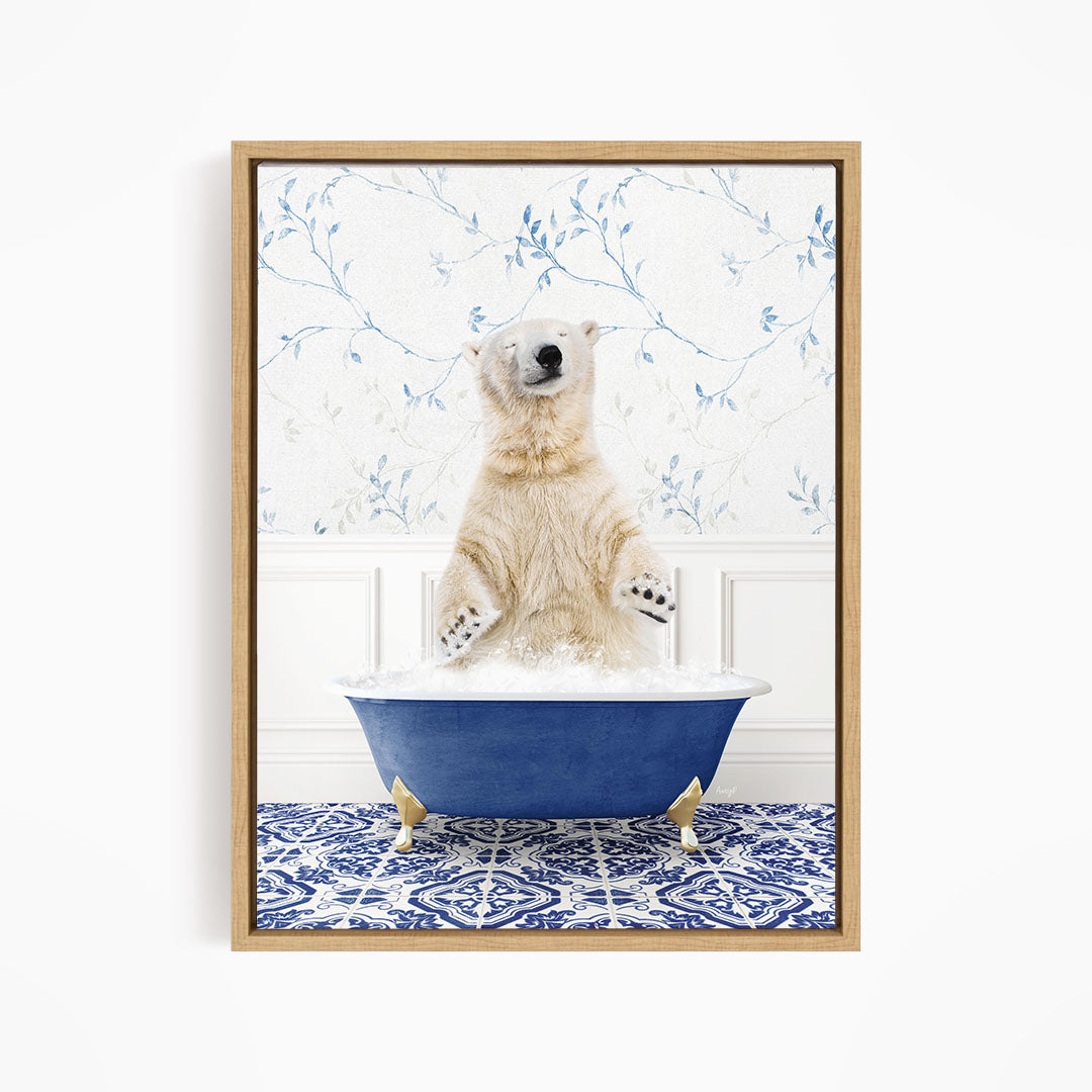 A polar bear sitting in a blue bathtub filled with bubbles, surrounded by a blue and white patterned rug.
