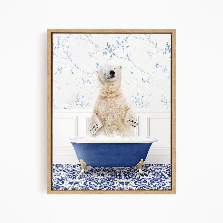 A polar bear sitting in a blue bathtub filled with bubbles, surrounded by a blue and white patterned rug.