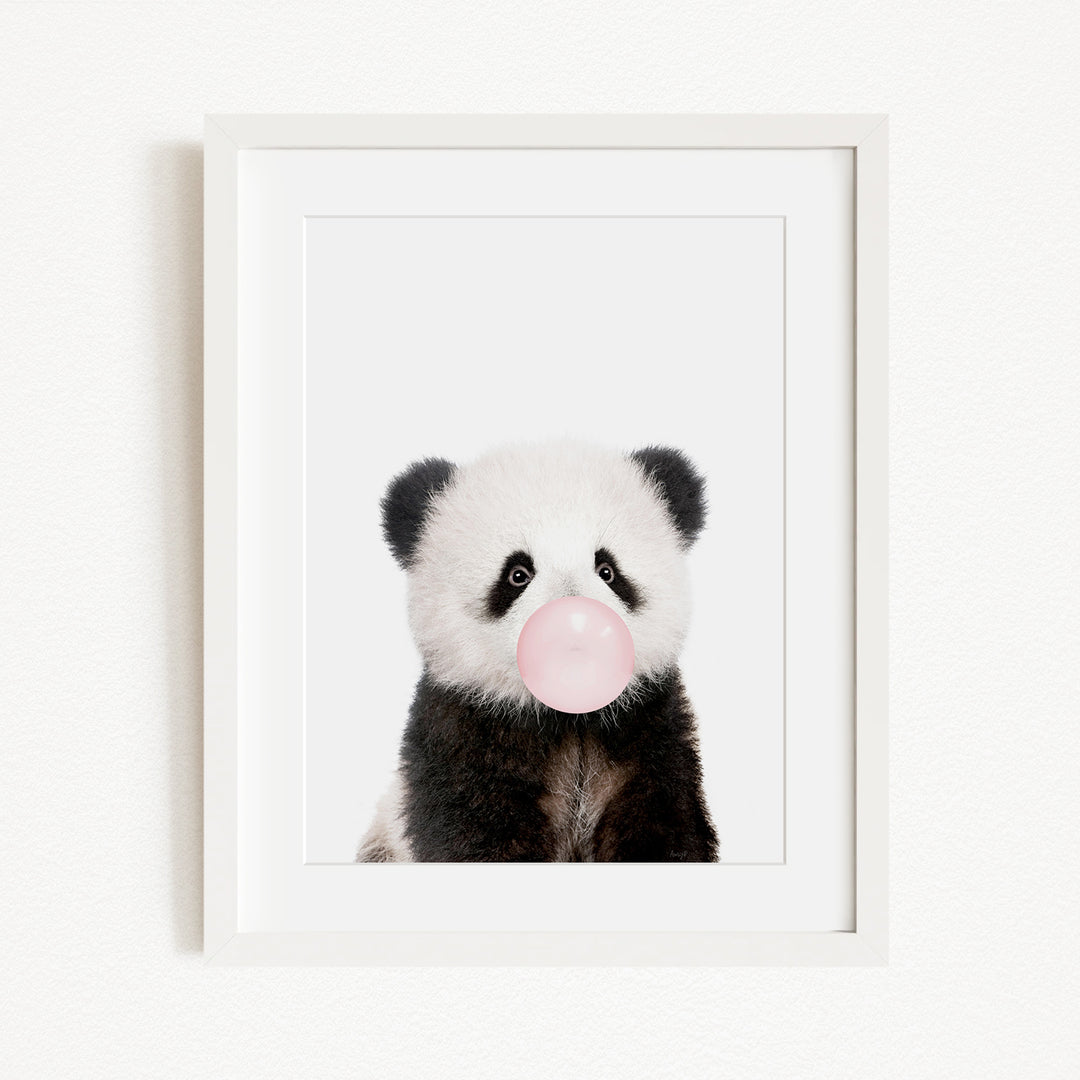 A cute panda bear blowing a bubble with a pink bubblegum bubble.