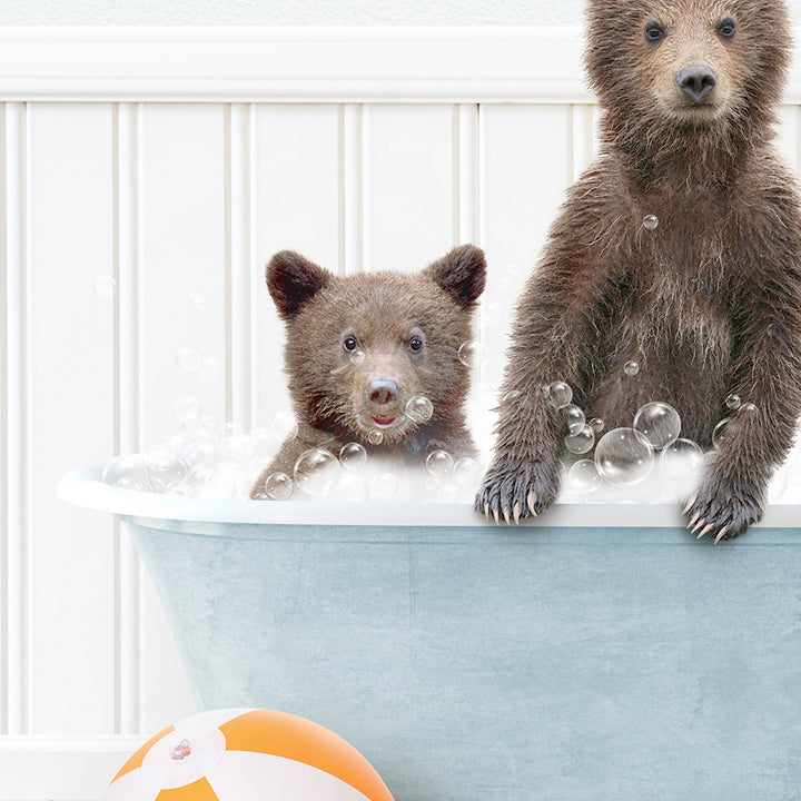 a couple of brown bears in a bath tub