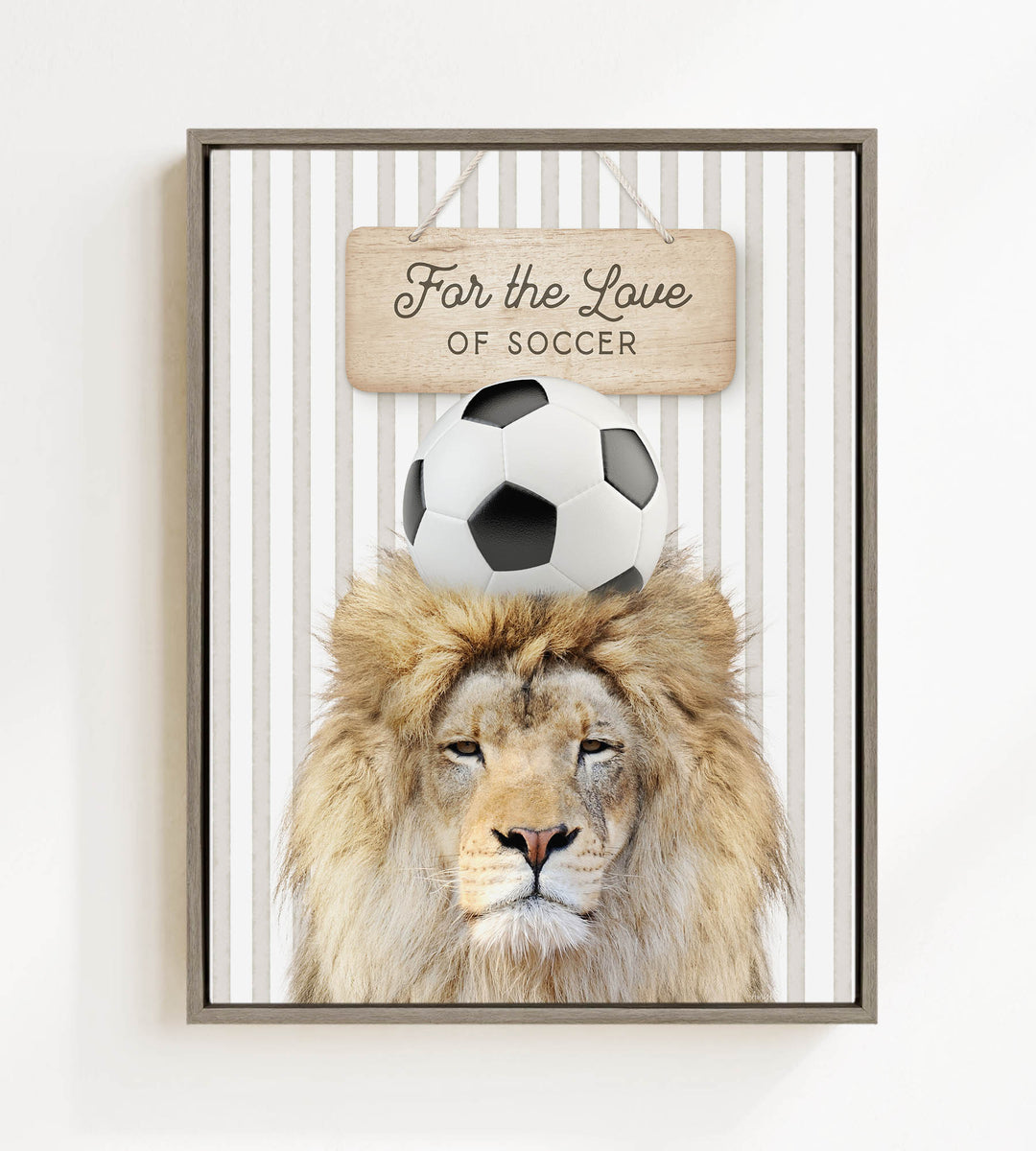 A framed image of a lion with a soccer ball on its head, accompanied by a wooden sign that reads "For the Love of Soccer".
