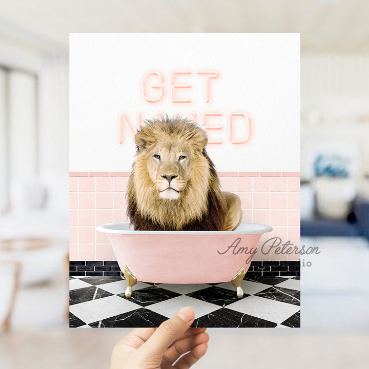 a hand holding a card with a lion in a bathtub