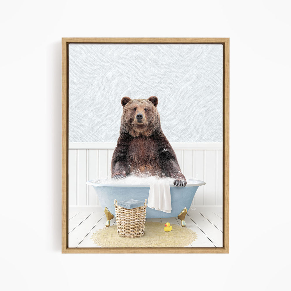 A brown bear sitting in a blue bathtub filled with water, surrounded by rubber ducks.