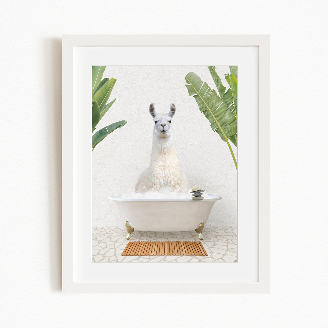 A white llama sitting in a white bathtub, surrounded by green plants, in a framed artwork.