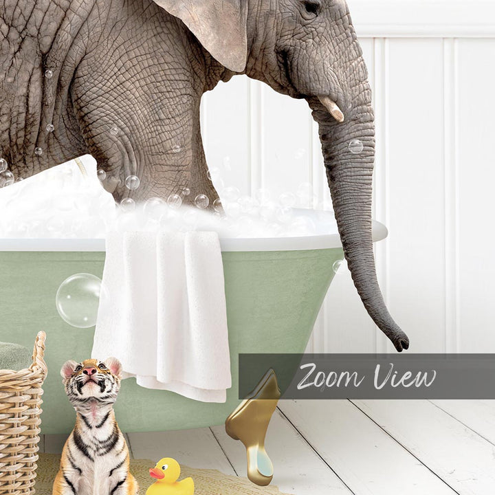 A large elephant is taking a bath in a green tub, surrounded by a rubber duck, a toy basket, and a towel.