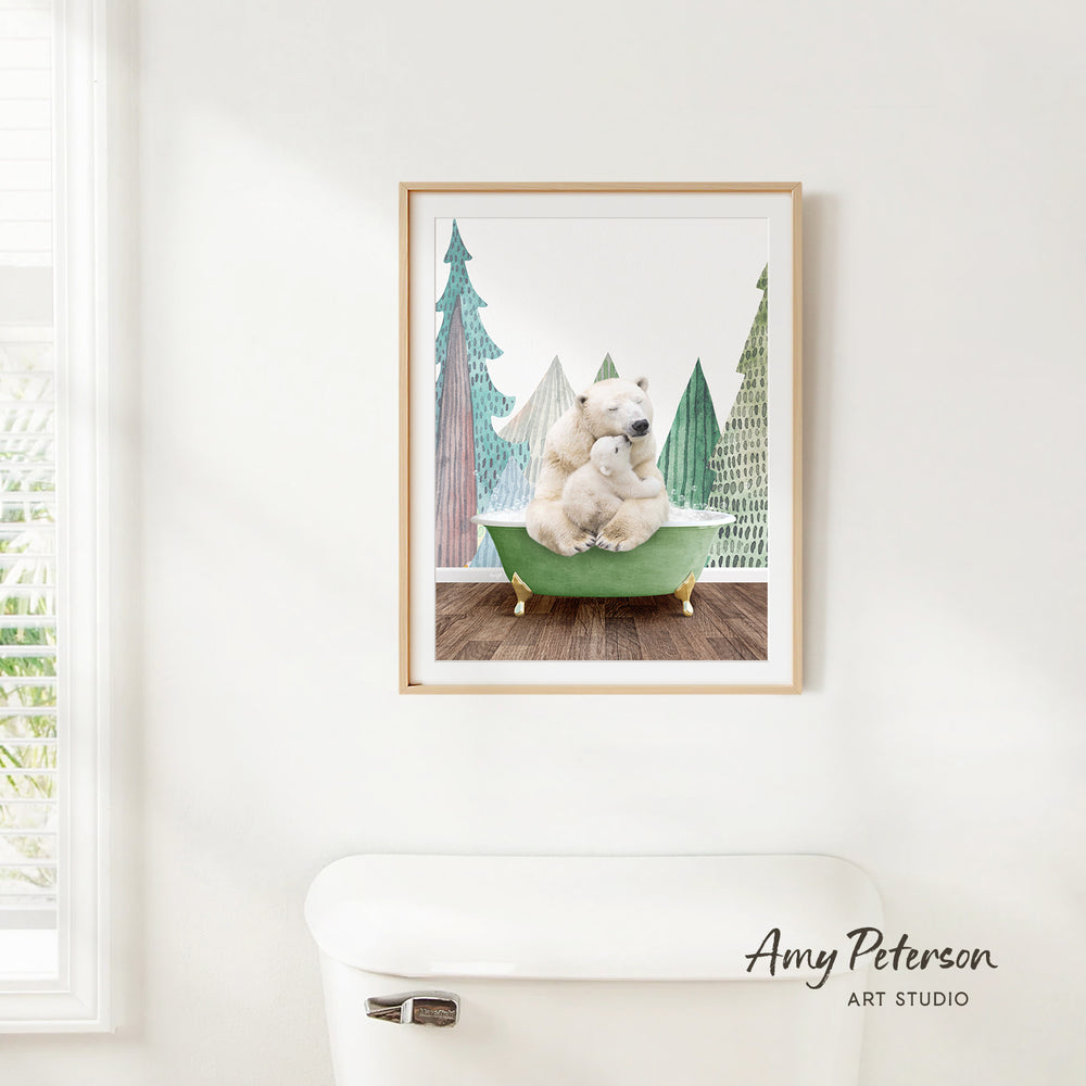A framed painting of a polar bear sitting in a bathtub, surrounded by pine trees, is hanging on a white wall.