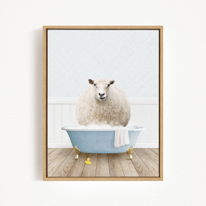 A fluffy white sheep sits in a blue bathtub filled with bubbles, surrounded by yellow rubber duckies.