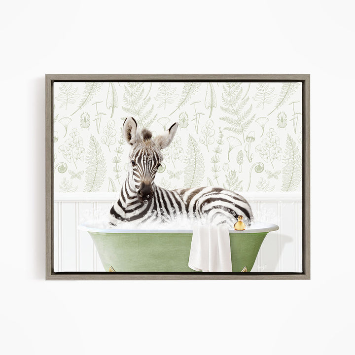 A zebra is sitting in a green bathtub filled with water, surrounded by a white wall with a pattern of ferns and other plants.