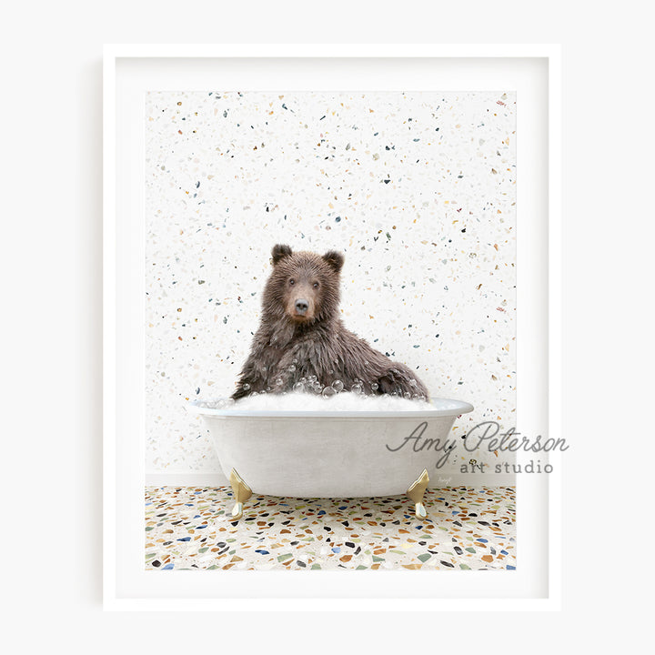 a brown bear sitting in a bath tub