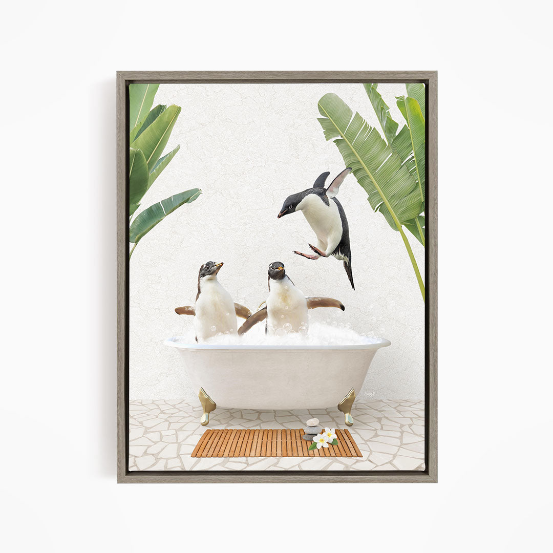 A framed image depicting two penguins sitting in a bathtub, surrounded by tropical plants and a bird flying overhead.