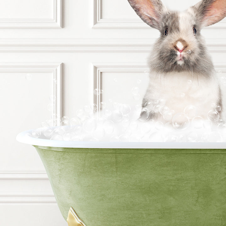 a rabbit sitting in a bathtub full of bubbles