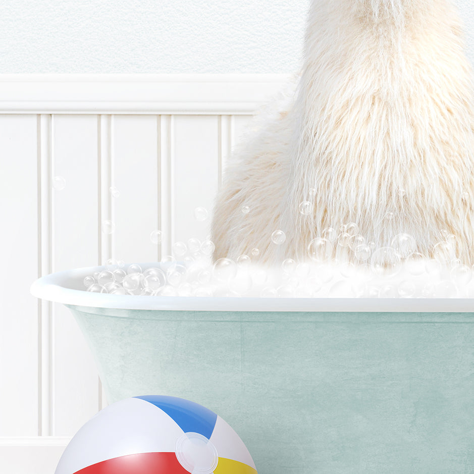 a white dog sitting in a bathtub with bubbles and a beach ball