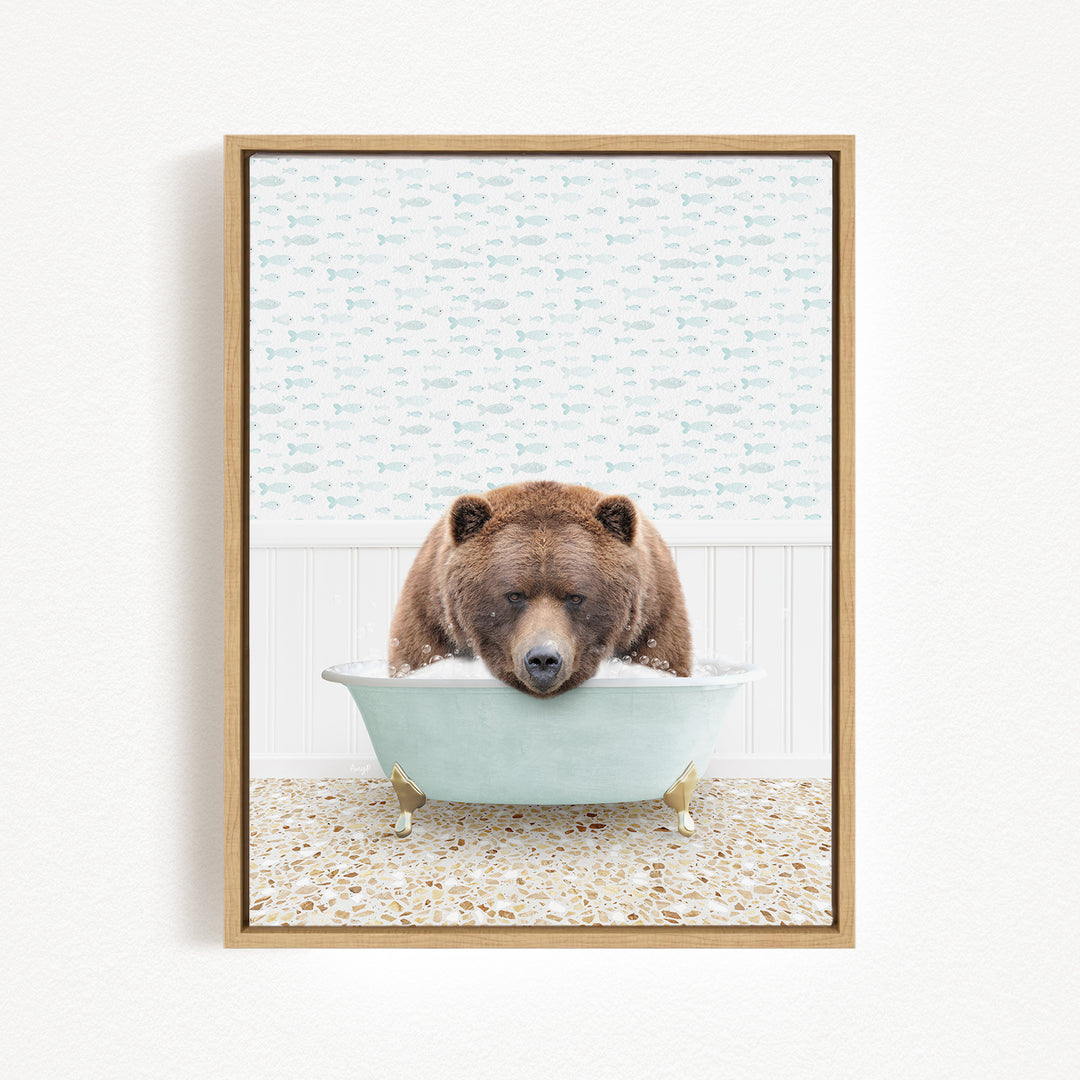 A brown bear is sitting in a light blue bathtub, surrounded by a patterned wall and a tiled floor.