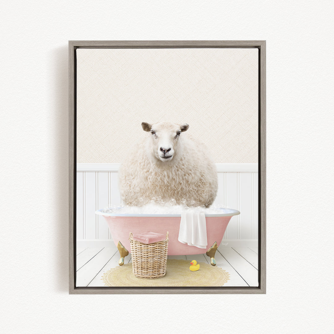 A fluffy white sheep sits in a pink bathtub filled with bubbles, surrounded by a yellow rubber duck and a wicker basket.