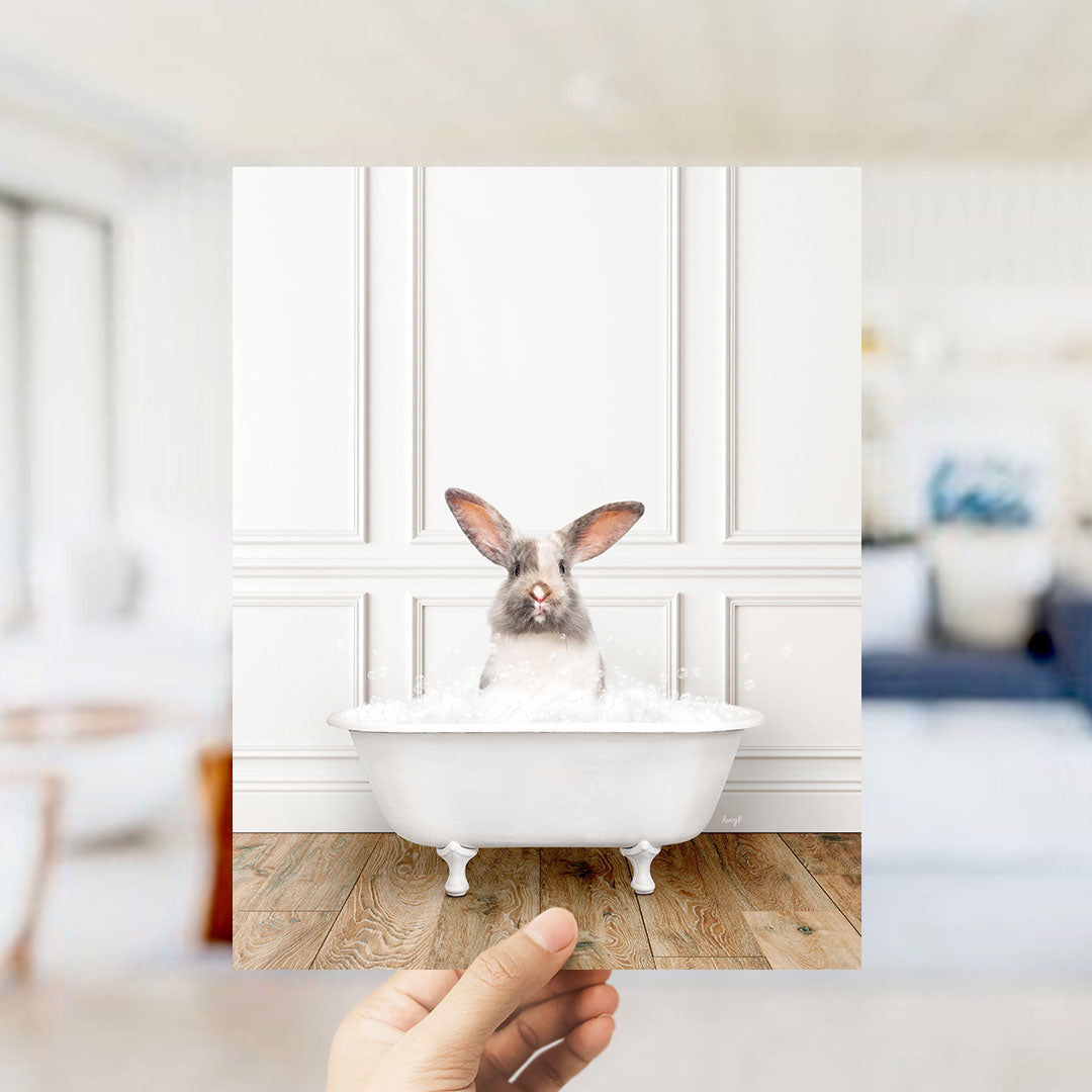 A white rabbit sitting in a white bathtub filled with water, with its head above the water's surface.