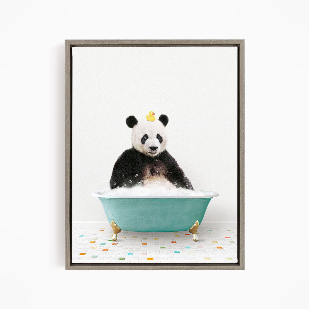 A panda bear sitting in a bathtub filled with bubbles, with a yellow rubber duck floating on its head.