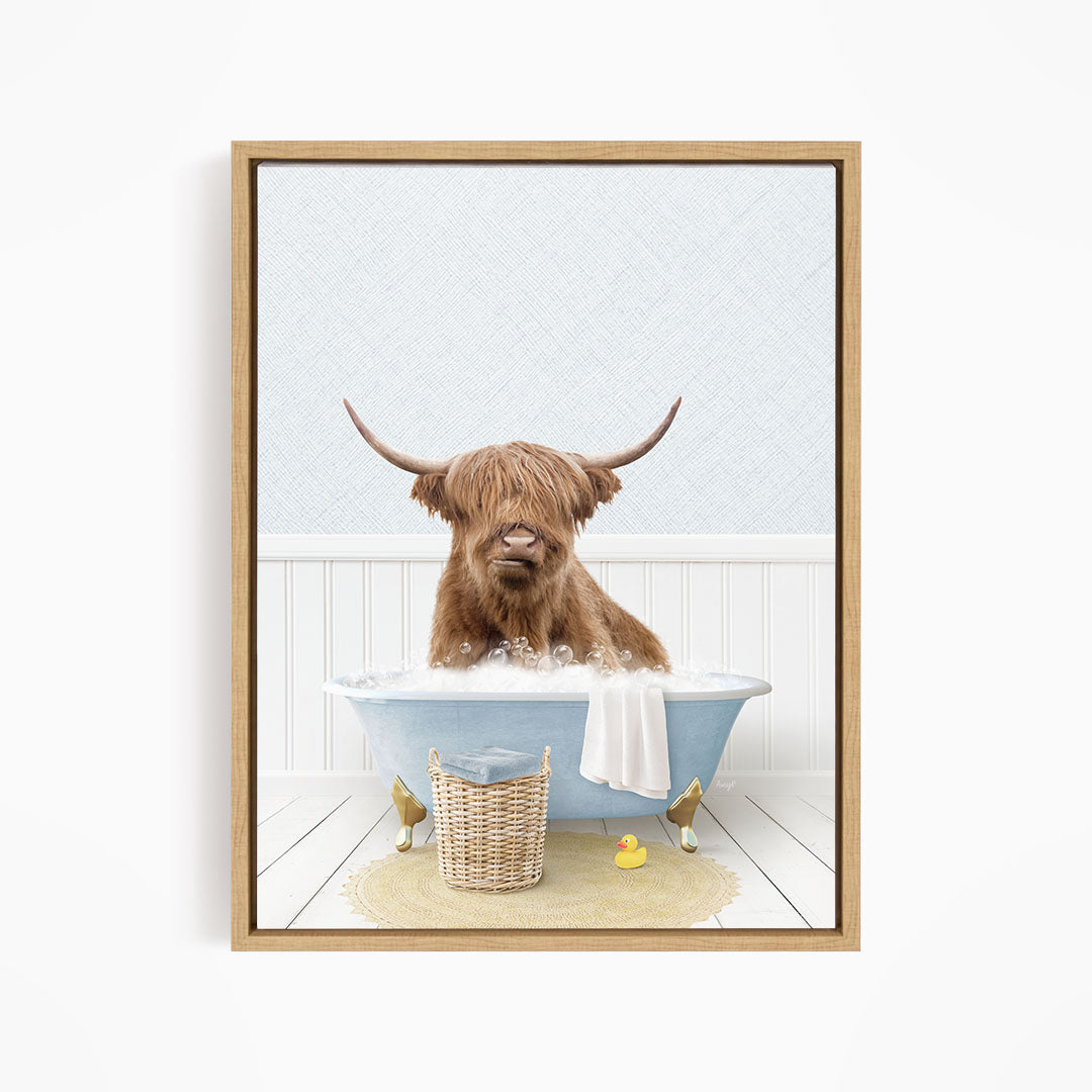 A brown cow with long horns is sitting in a blue bathtub filled with water, surrounded by rubber ducks.