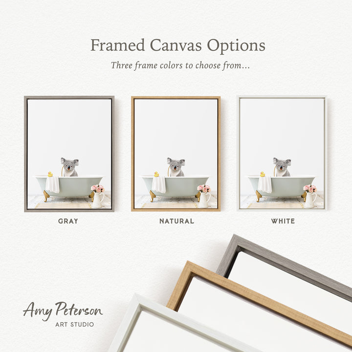 three framed canvas options, each featuring a koala sitting in a bathtub with various accessories, such as a yellow rubber duck and pink flowers. The options include a gray frame, a natural frame, and a white frame.