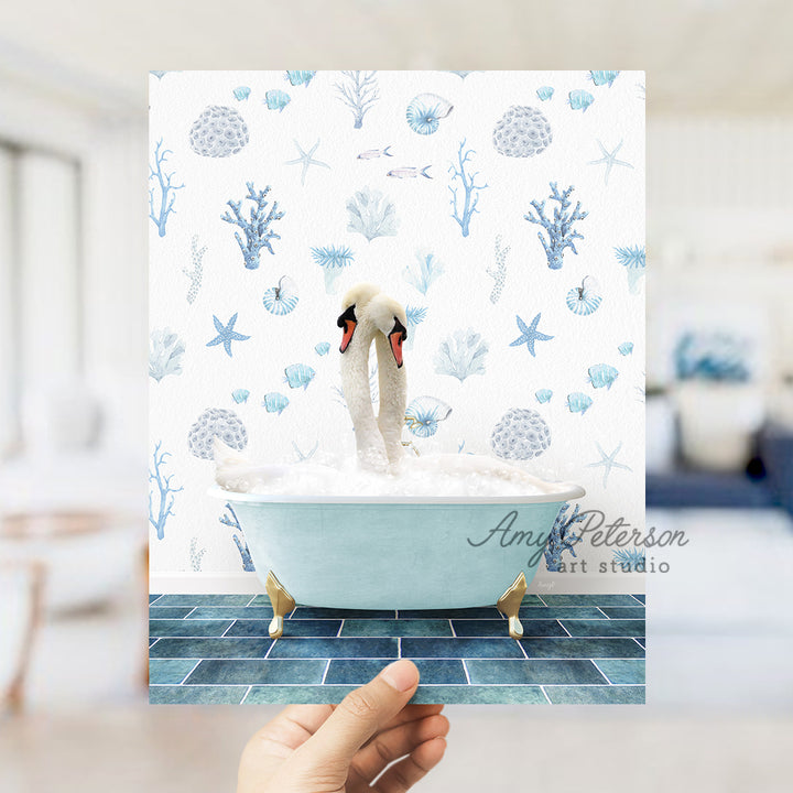 a person holding up a card with a picture of a swan in a bathtub