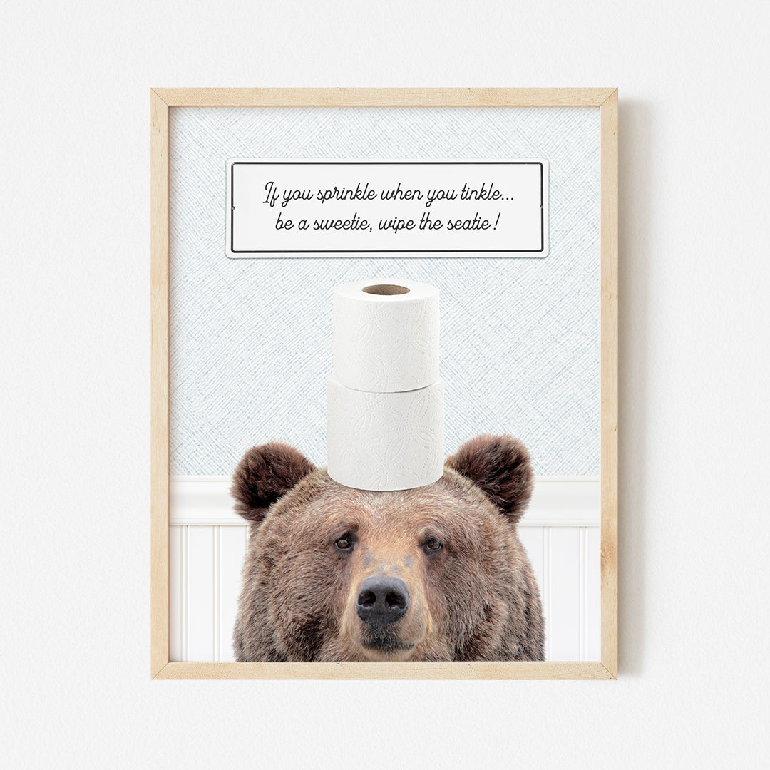 a picture of a bear with a roll of toilet paper on its head