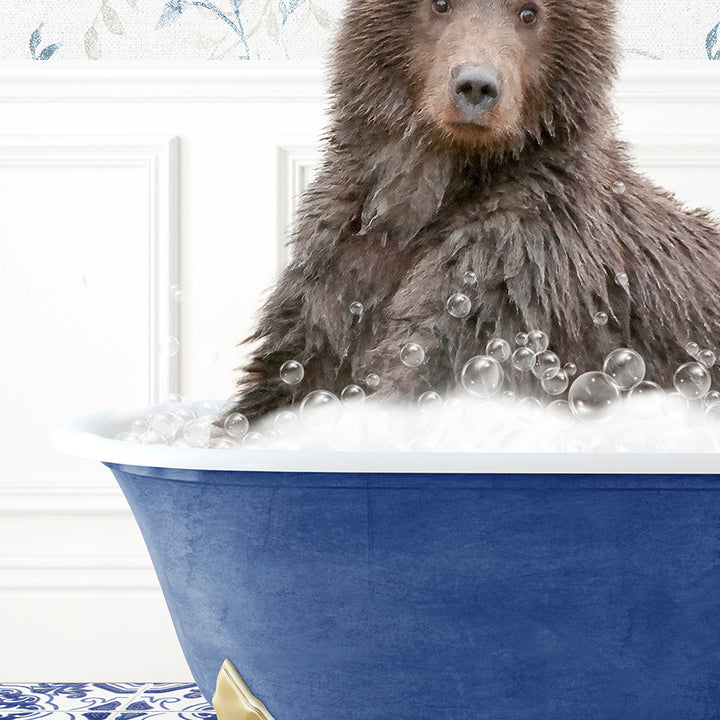 a brown bear sitting in a blue bath tub