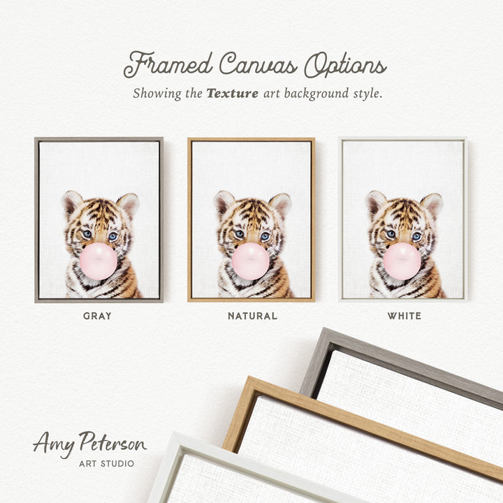 three framed prints of a tiger blowing a bubble with a pink bubblegum bubble. The prints are in different color schemes, including gray, natural, and white.