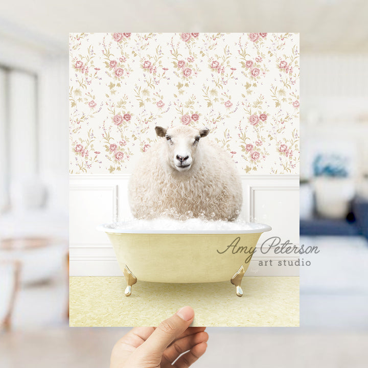 a hand holding a card with a sheep in a bathtub