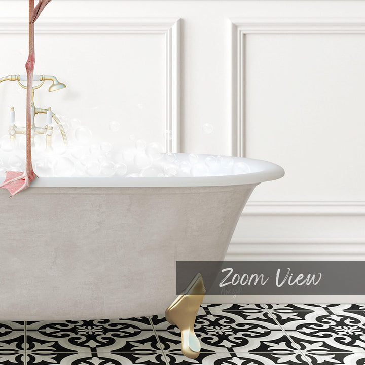 A white claw-foot bathtub filled with water, with a gold faucet and a pink flower in the tub. The bathtub is set against a white wall with a black and white patterned tile floor.