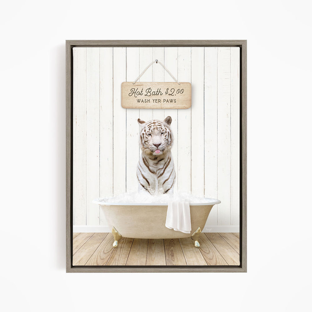 A white tiger sitting in a bathtub, with a sign above it that says "Hot Bath $2.00 Wash Your Paws".