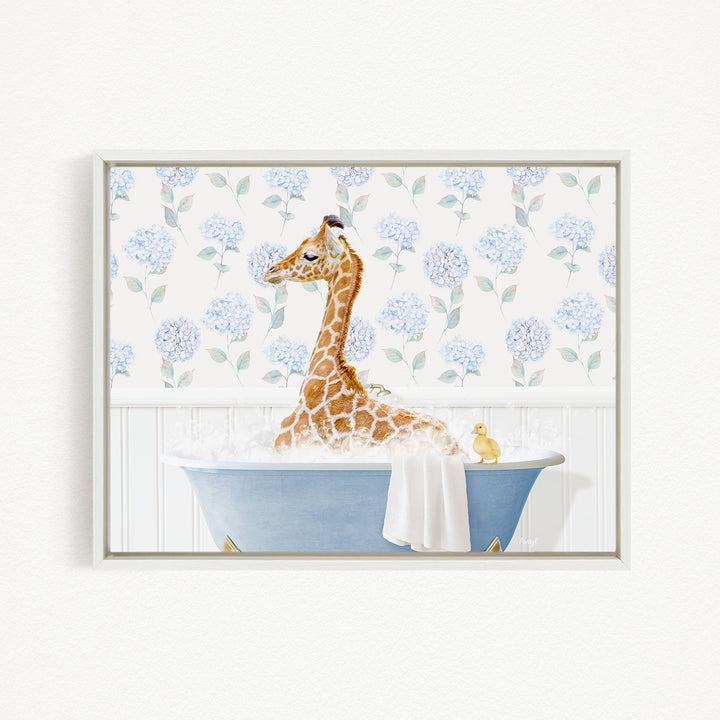 A giraffe sitting in a blue bathtub filled with water, surrounded by blue flowers on the wall behind it.