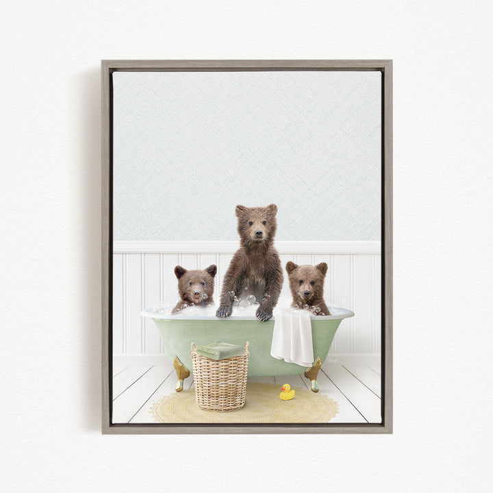 A framed image depicting three bears sitting in a bathtub, with one bear sitting in the center and the other two bears sitting on either side.