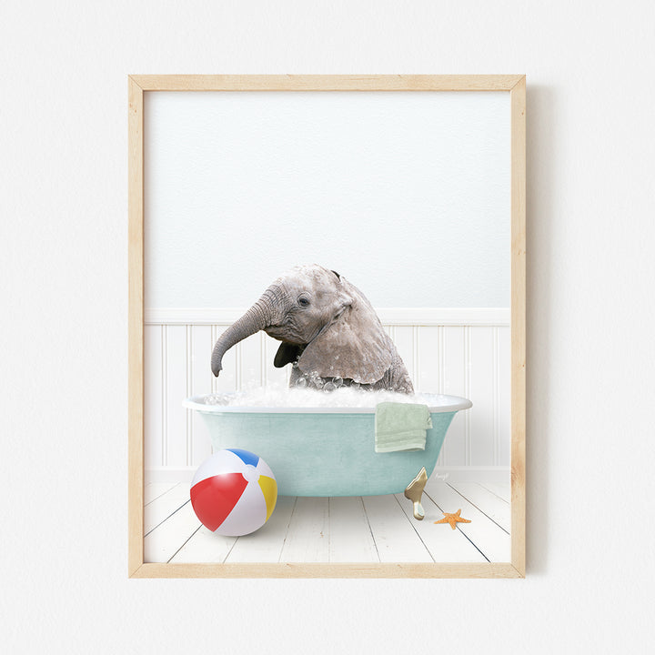 a picture of an elephant in a bathtub with a beach ball