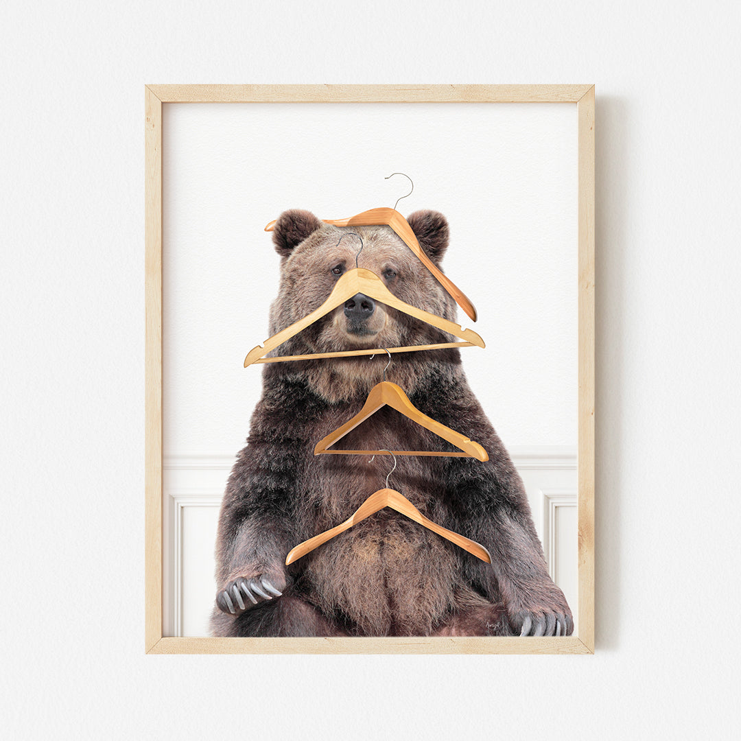 a picture of a bear with clothes hangers on it