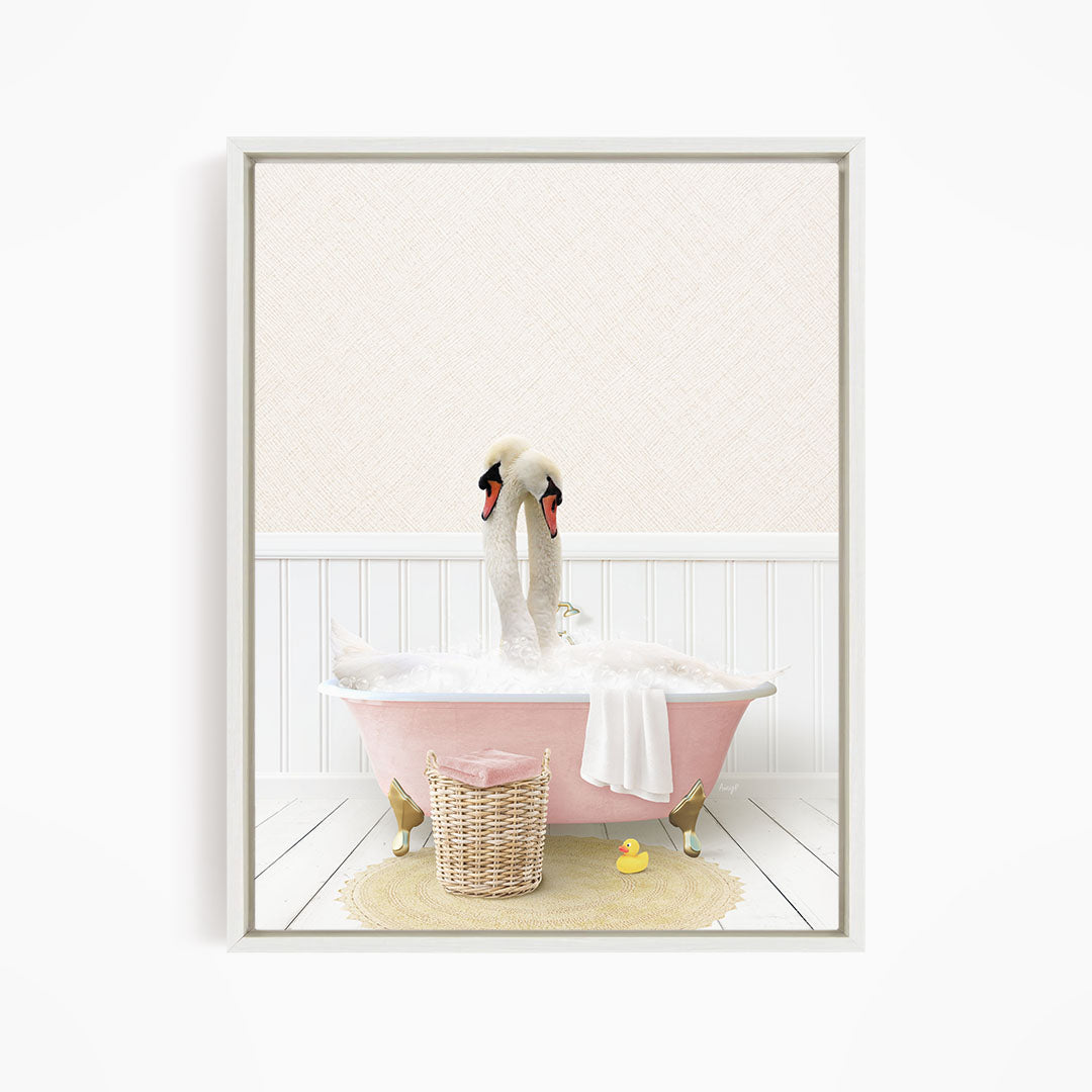 A pink clawfoot bathtub filled with bubbles, with two swans sitting inside and one duck standing on the edge.