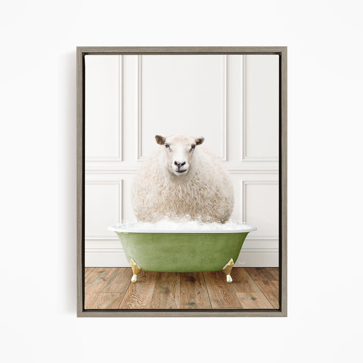 A fluffy white sheep sits in a green bathtub filled with bubbles, looking directly at the camera.