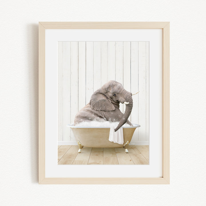 A gray elephant sitting in a bathtub filled with water, with its trunk raised and appearing to be enjoying the bath.