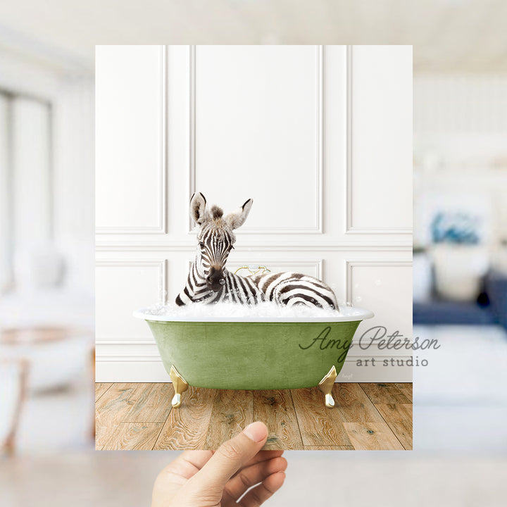 a zebra laying in a green bath tub