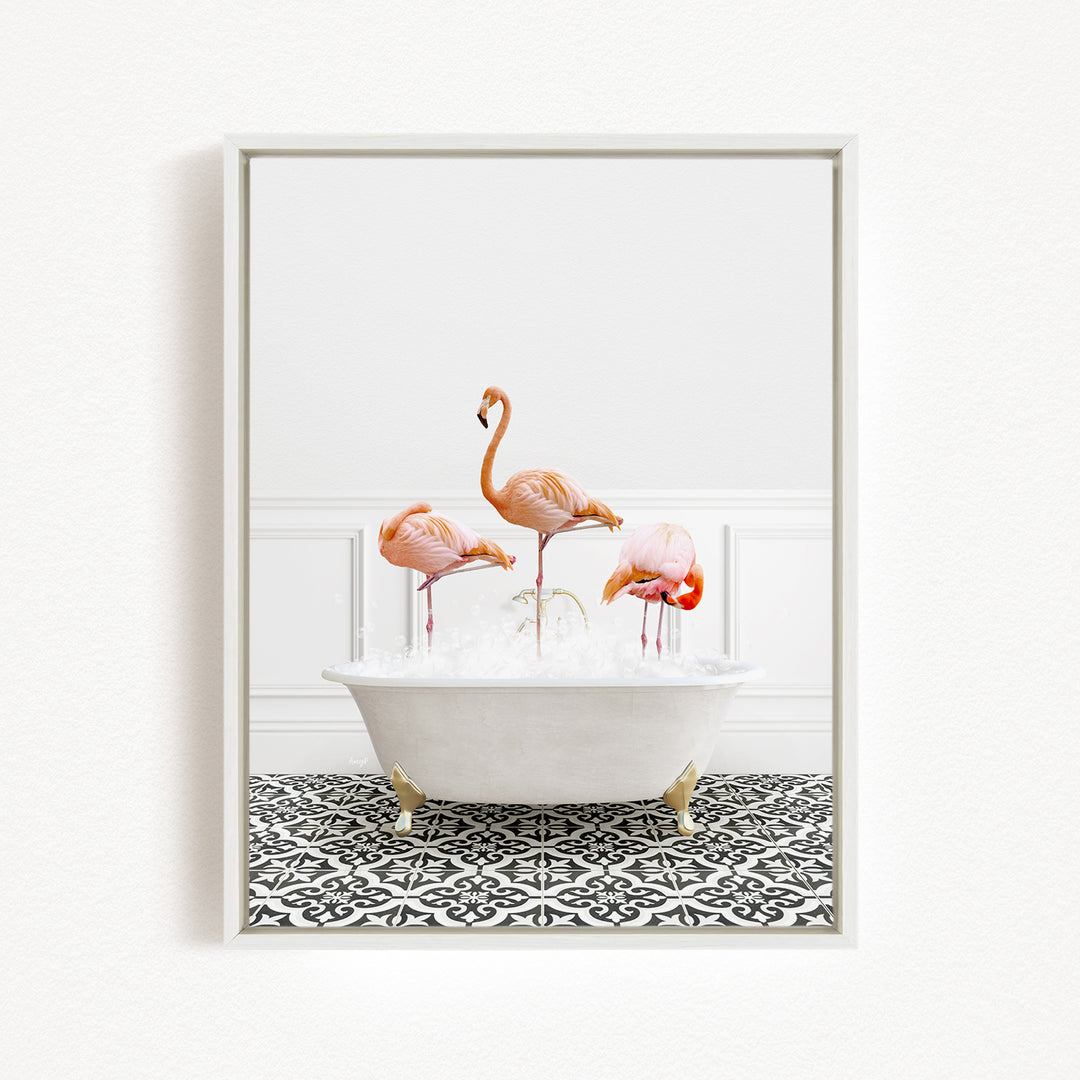 A framed image of three flamingos standing in a white bathtub filled with water, creating a whimsical and playful scene.