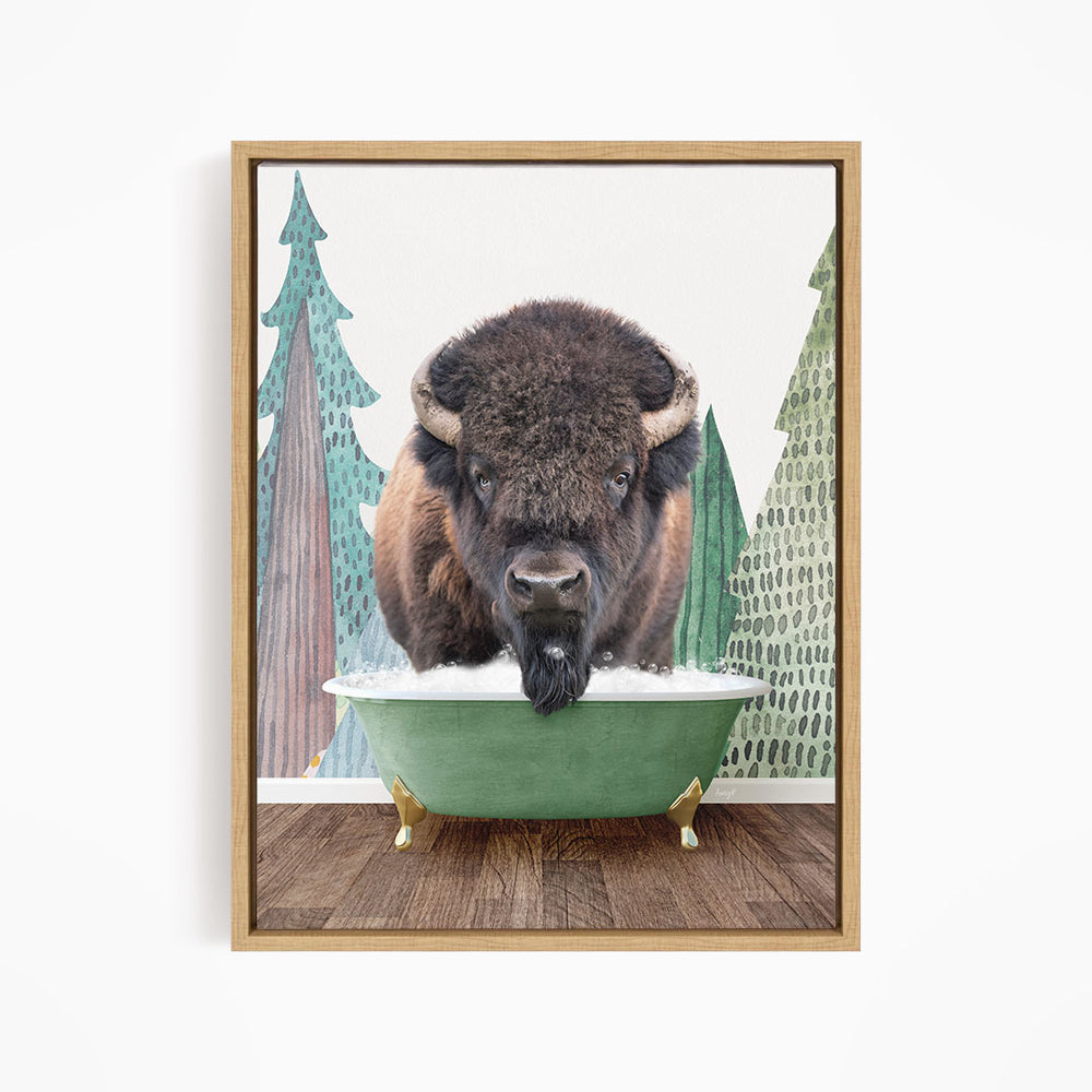 A bison with a long beard is sitting in a green bathtub, surrounded by trees and a forest-like background.