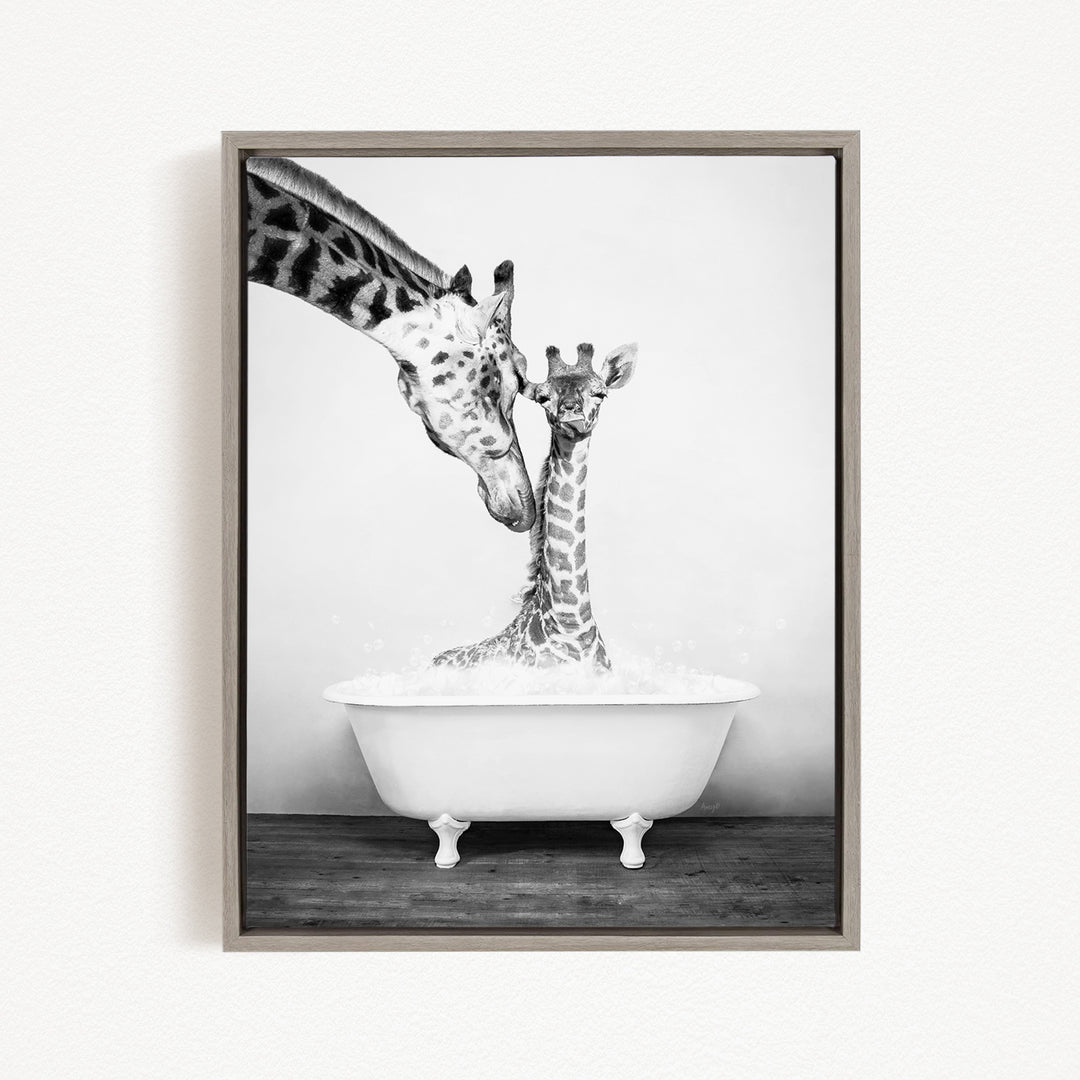 A mother giraffe and her baby giraffe enjoying a bath together in a white bathtub.