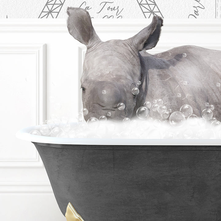 a rhino laying in a bathtub filled with bubbles